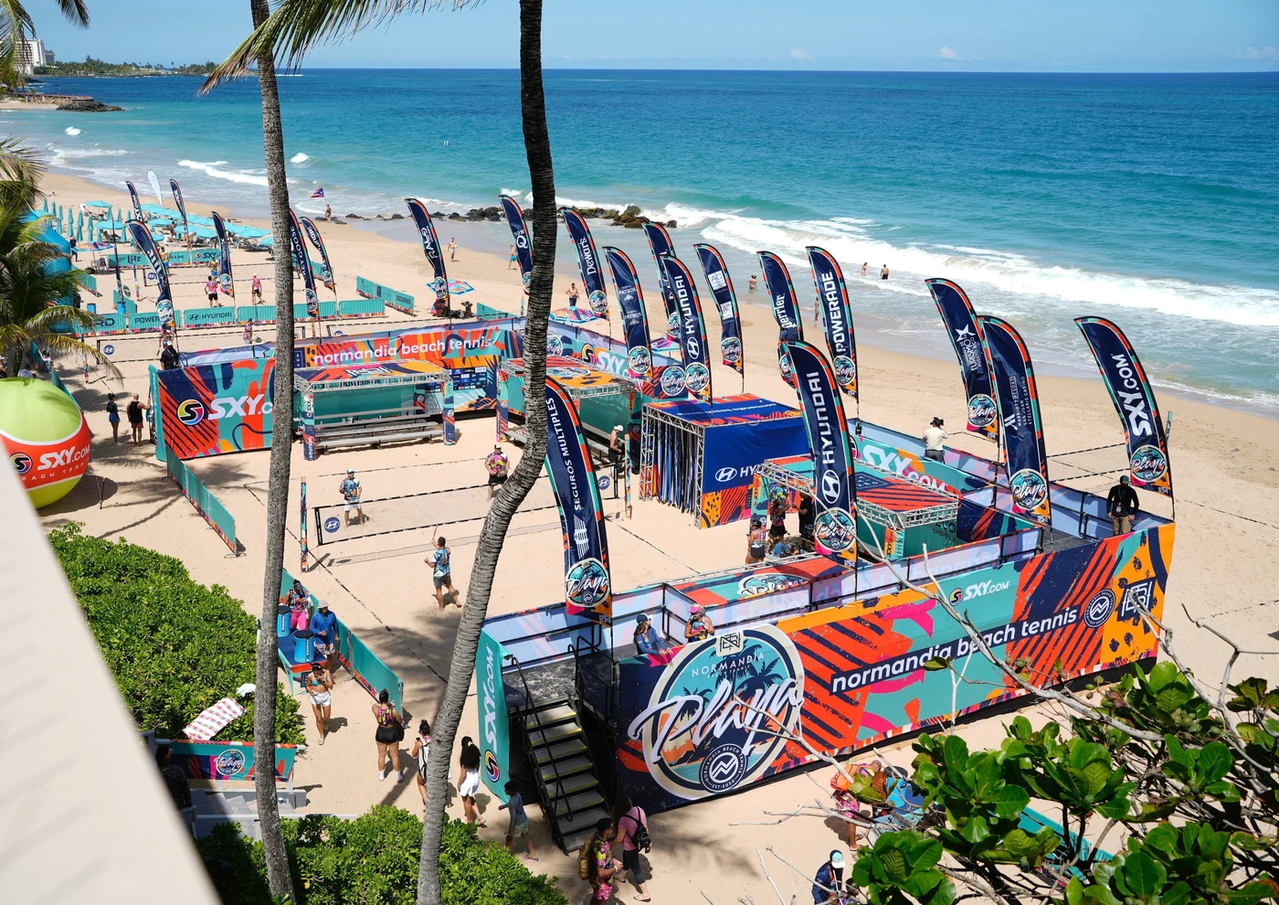 Beach tennis players competing on sand